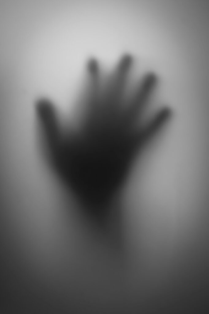 scary hand veiled in mist to evoke the chills and thrills of the exclusive ghost and true crime walking tour