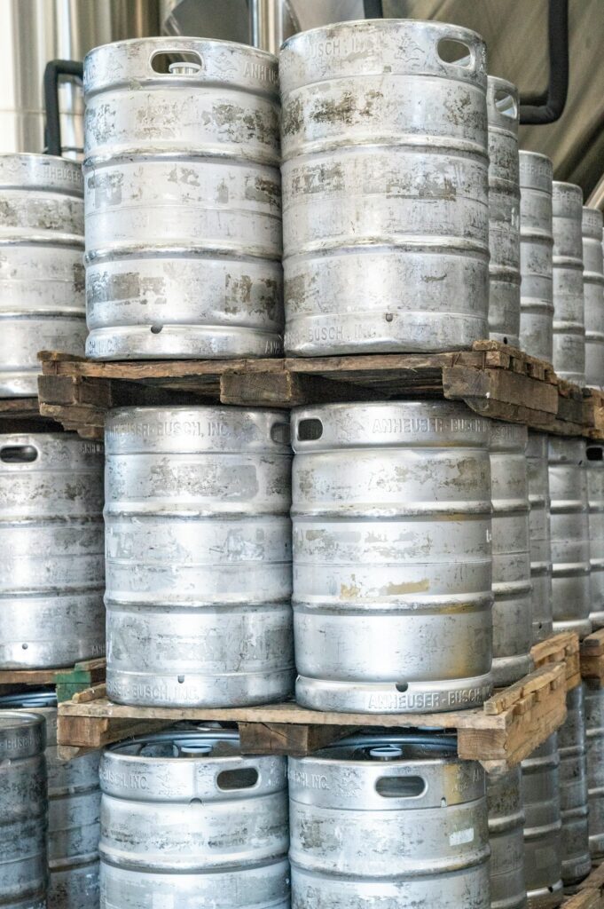 silver kegs of beer on palettes stacked high to give an idea of what you'll see on tours of Corvallis history of beer that ends at sky high brewery