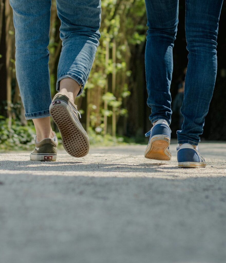 Two people wearing jeans on a walking tour of Corvallis history - a team building activity in corvallis oregon
